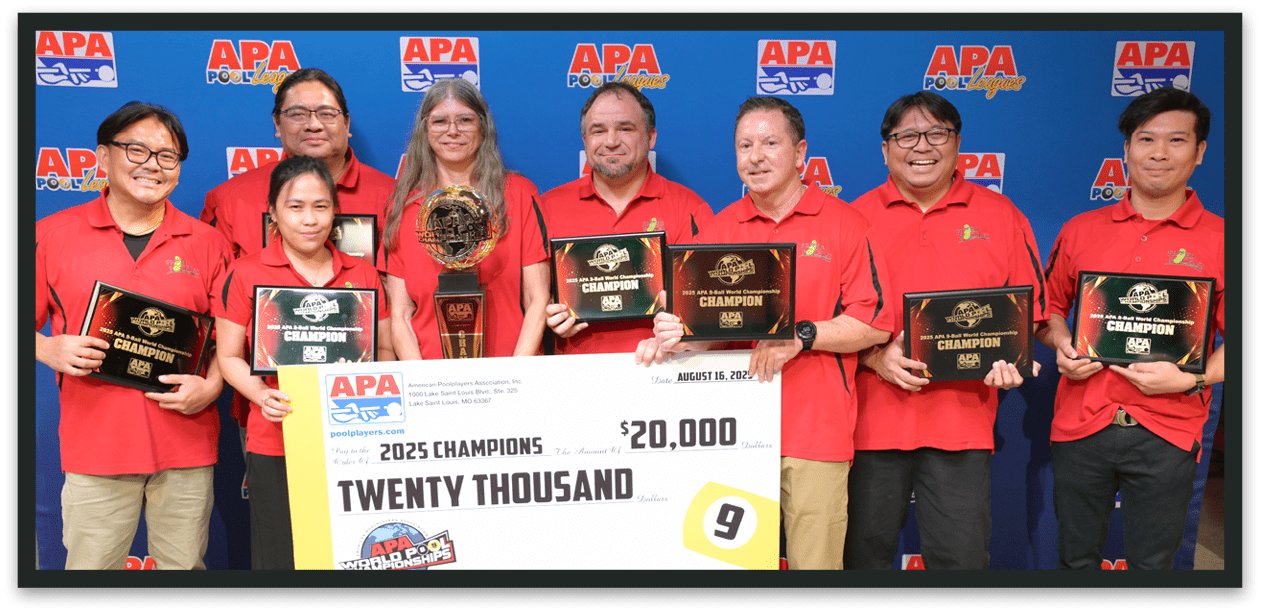A group of eight adults wearing matching red shirts stand together smiling while holding trophies, plaques, and a large check for a championship prize. Description generated by AI